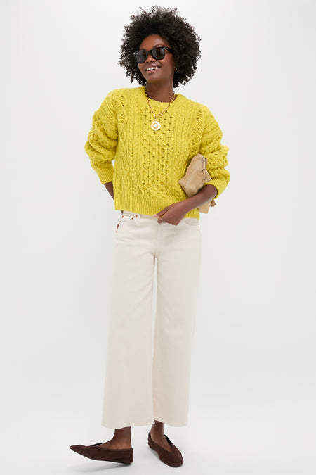 Person models classic, effortless style with Seal Brown Courtney Flats, featuring a squared-off toe, suede finish; paired with chic outfit for a fun, high-end look.