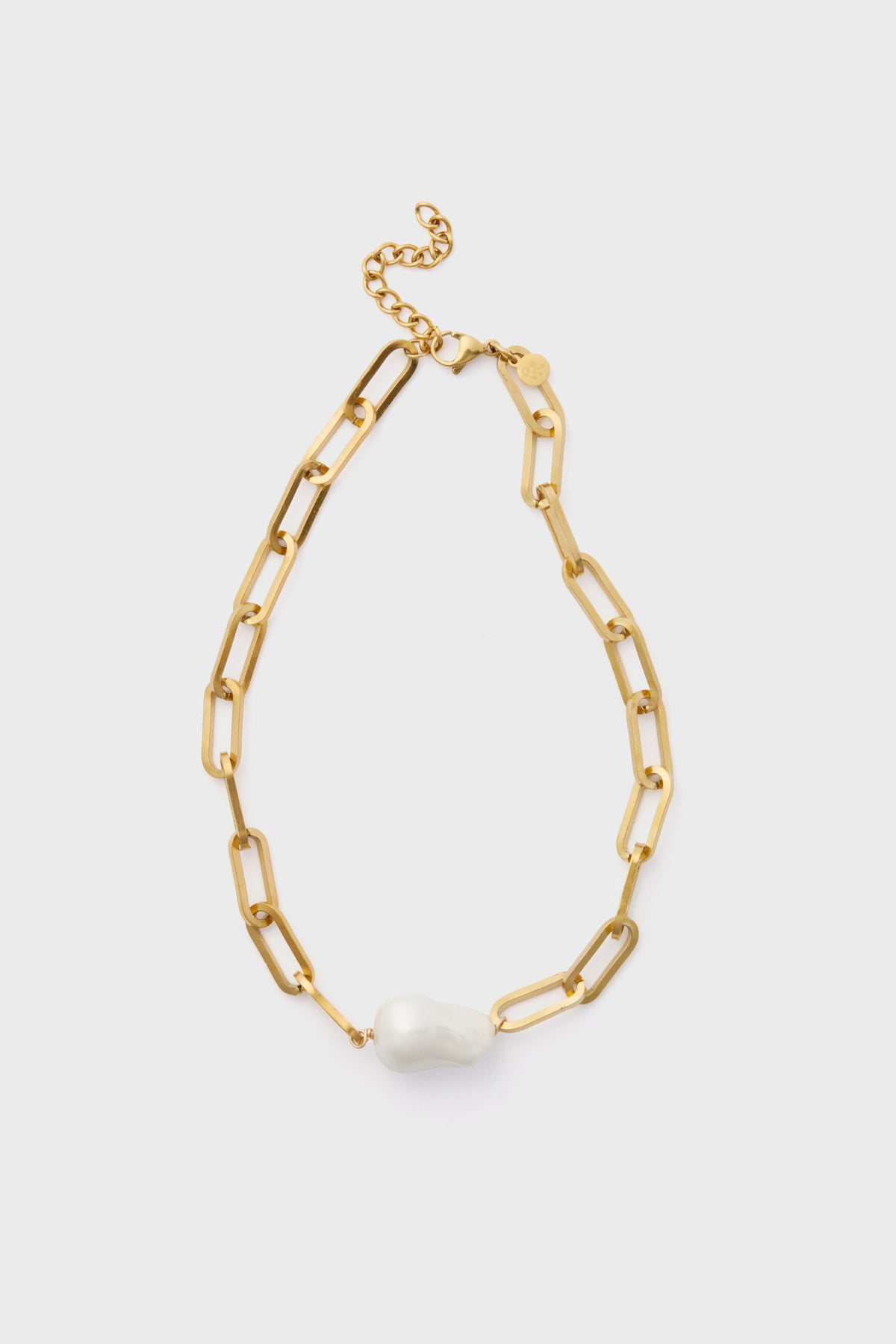 The Petit Moments Gold Elizabeth Necklace features large gold-tone rectangular links and a single irregular white pearl pendant for an elegant look.