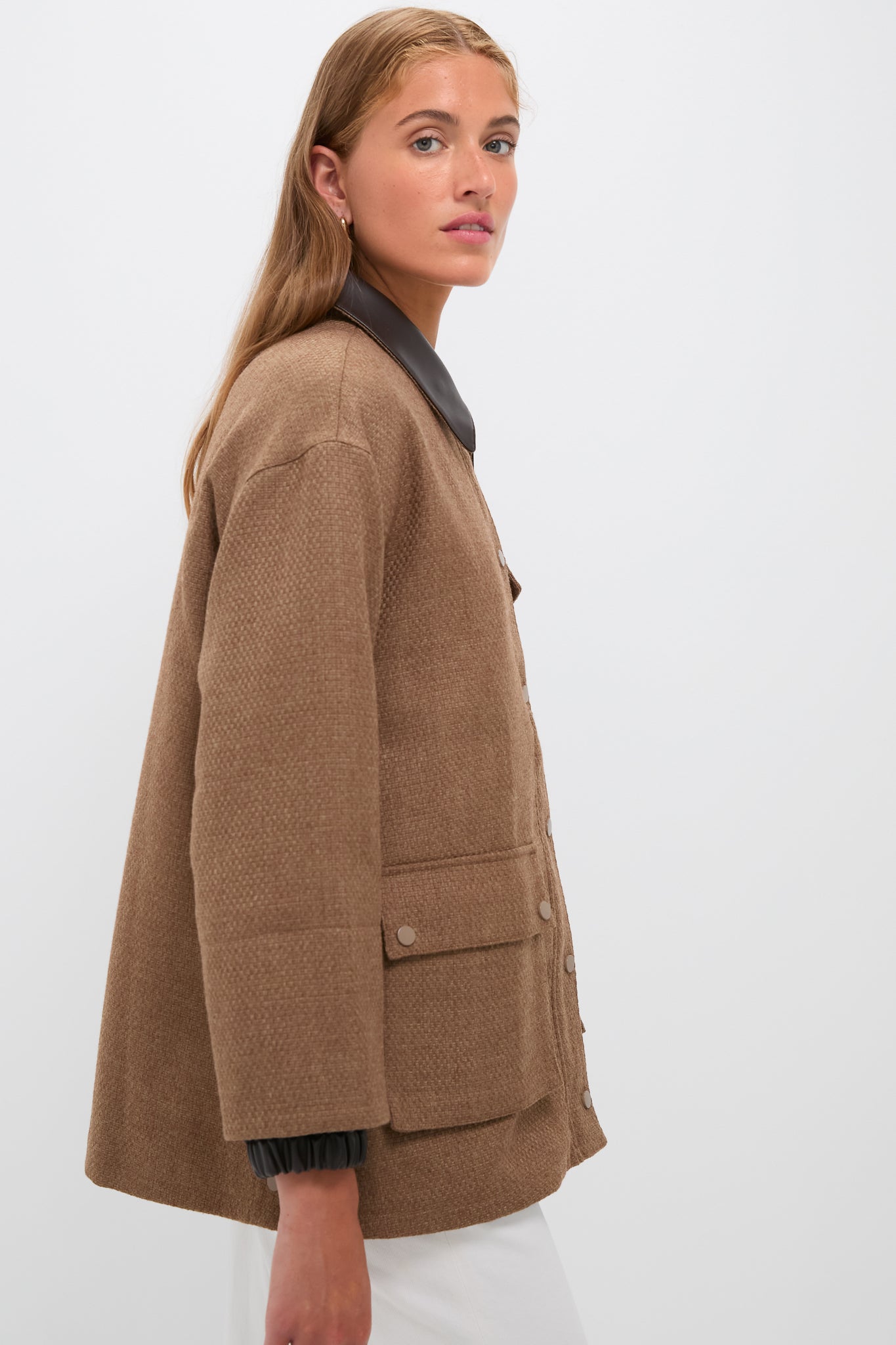 Young woman models the classic Brown Bourbon Jacket with faux leather collar and snap-flap pockets, embodying an effortless, high-end style perfect for fun, versatile occasions.