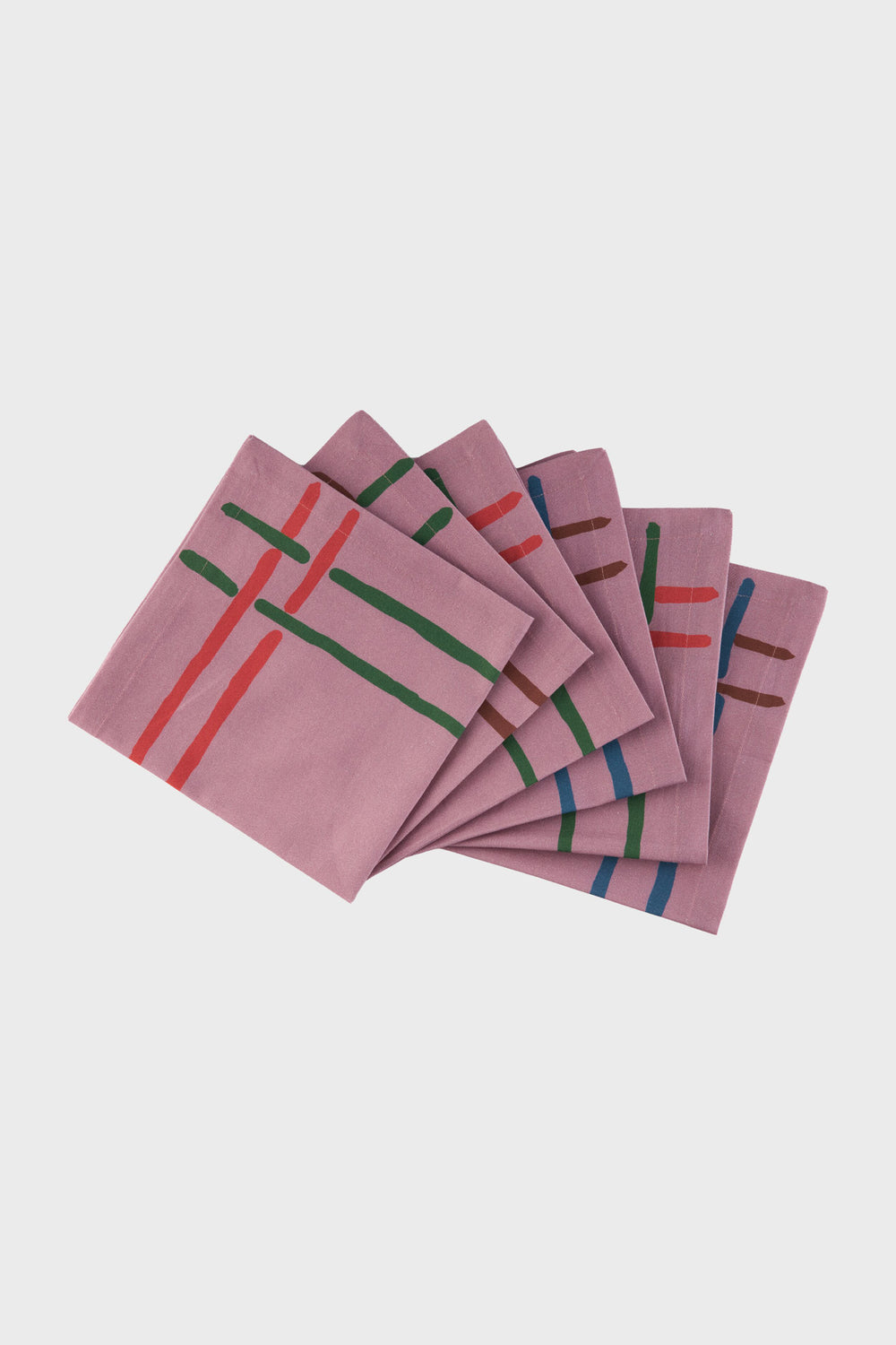 Six folded purple organic cotton napkins from Sophie Williamson Design, featuring abstract red, green, blue, and brown stripes, are arranged in a fan on a plain background—ideal for sustainable home decor.