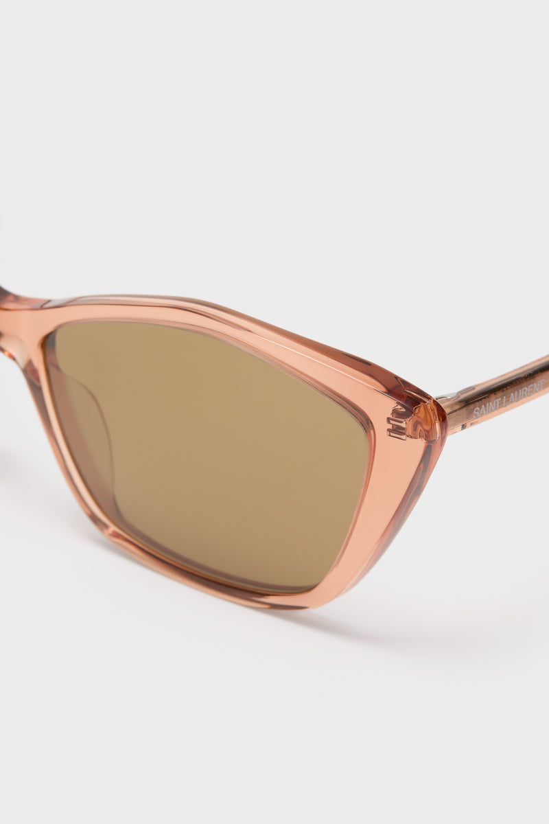 Shiny Transparent Amber Brown Lettering Logo Thin Sunglasses with a classic cat-eye frame and subtle Saint Laurent branding, offering effortless, high-end style and 100% UV protection.