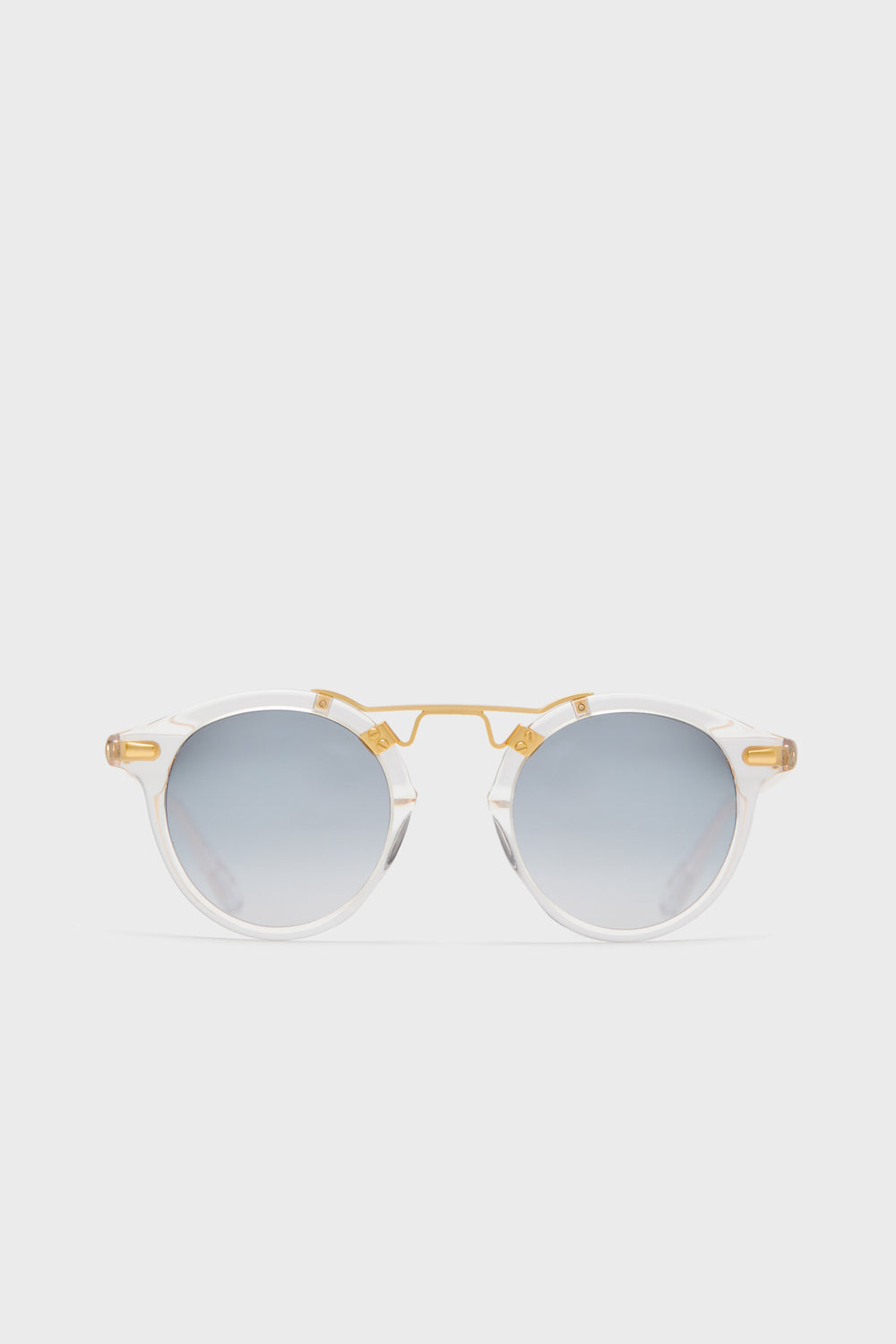 KREWE du optic round clear acetate sunglasses feature a 24k gold-plated bridge and arms, mirrored lenses, and handcrafted frames for a stylish, modern look.