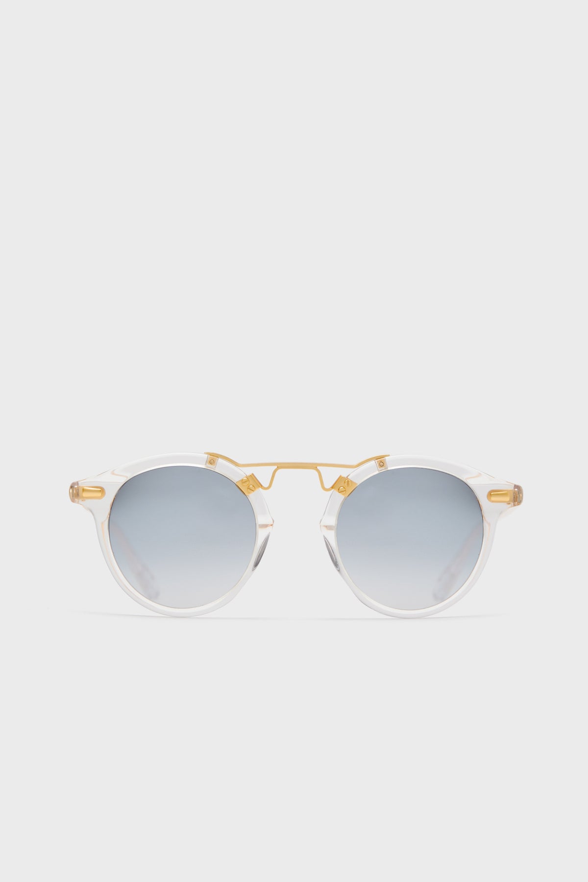 KREWE du optic round clear acetate sunglasses feature a 24k gold-plated bridge and arms, mirrored lenses, and handcrafted frames for a stylish, modern look.