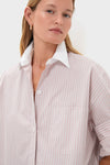 Close-up of a person wearing a Spanish Villa and White Next Ex Shirt, featuring a classic, high-end design with a crisp white collar and rolled-up sleeves for an effortless, fun look.