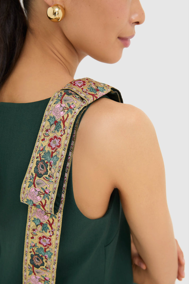 Effortlessly chic, the Garden Scrollwork Jacquard Bow Rosie Dress showcases classic elegance with its floral-embroidered strap and gold-ball earring accent, perfect for high-end occasions.