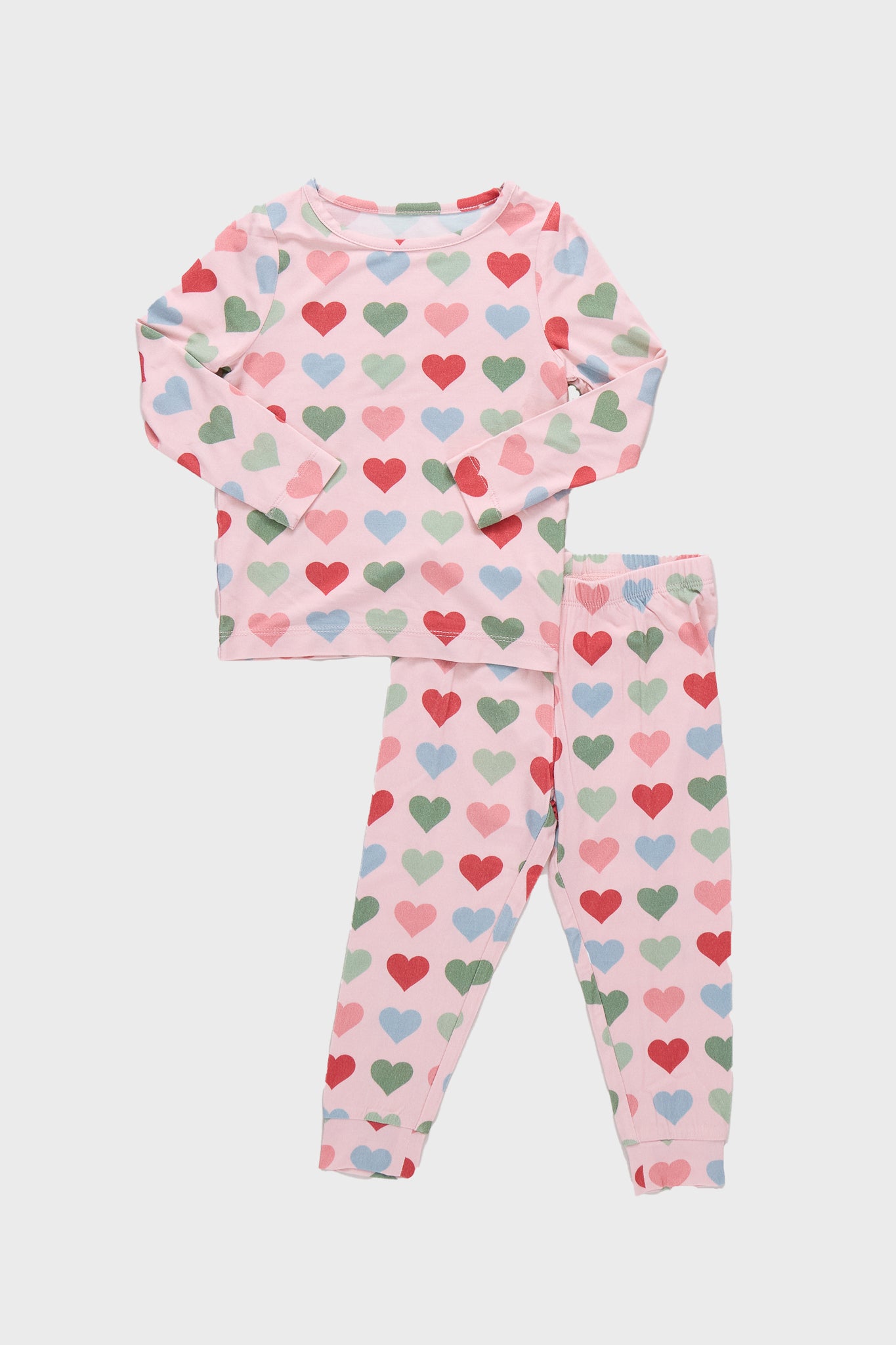 Pink Small Hearts Kids Bamboo Pj Set features a classic, effortless two-piece design with a fun heart pattern, crafted from high-end, breathable bamboo for ultimate comfort.
