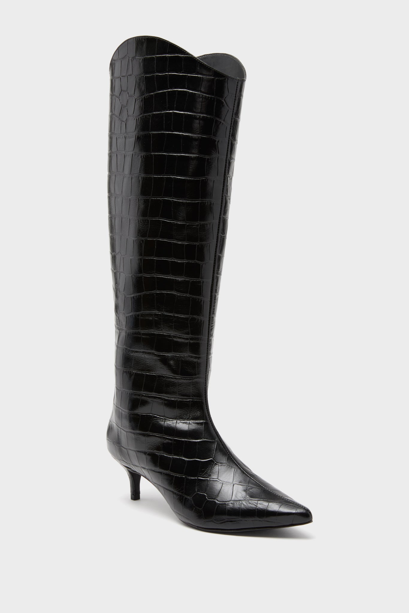 Schutz black knee-high boot featuring a pointed toe, kitten heel, and glossy croc-embossed leather—a sophisticated take inspired by the iconic Maryana Lo Boots.