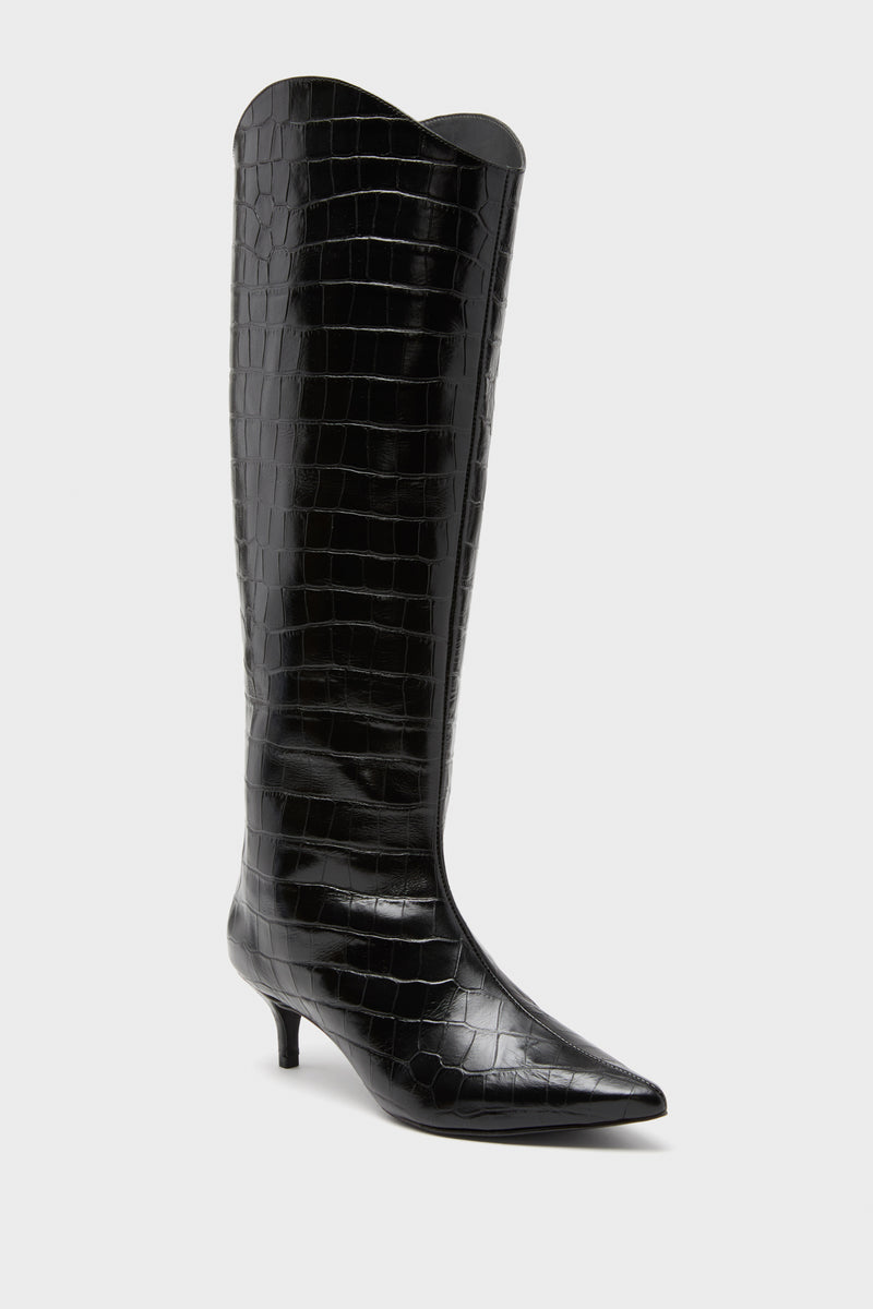 Schutz black knee-high boot featuring a pointed toe, kitten heel, and glossy croc-embossed leather—a sophisticated take inspired by the iconic Maryana Lo Boots.
