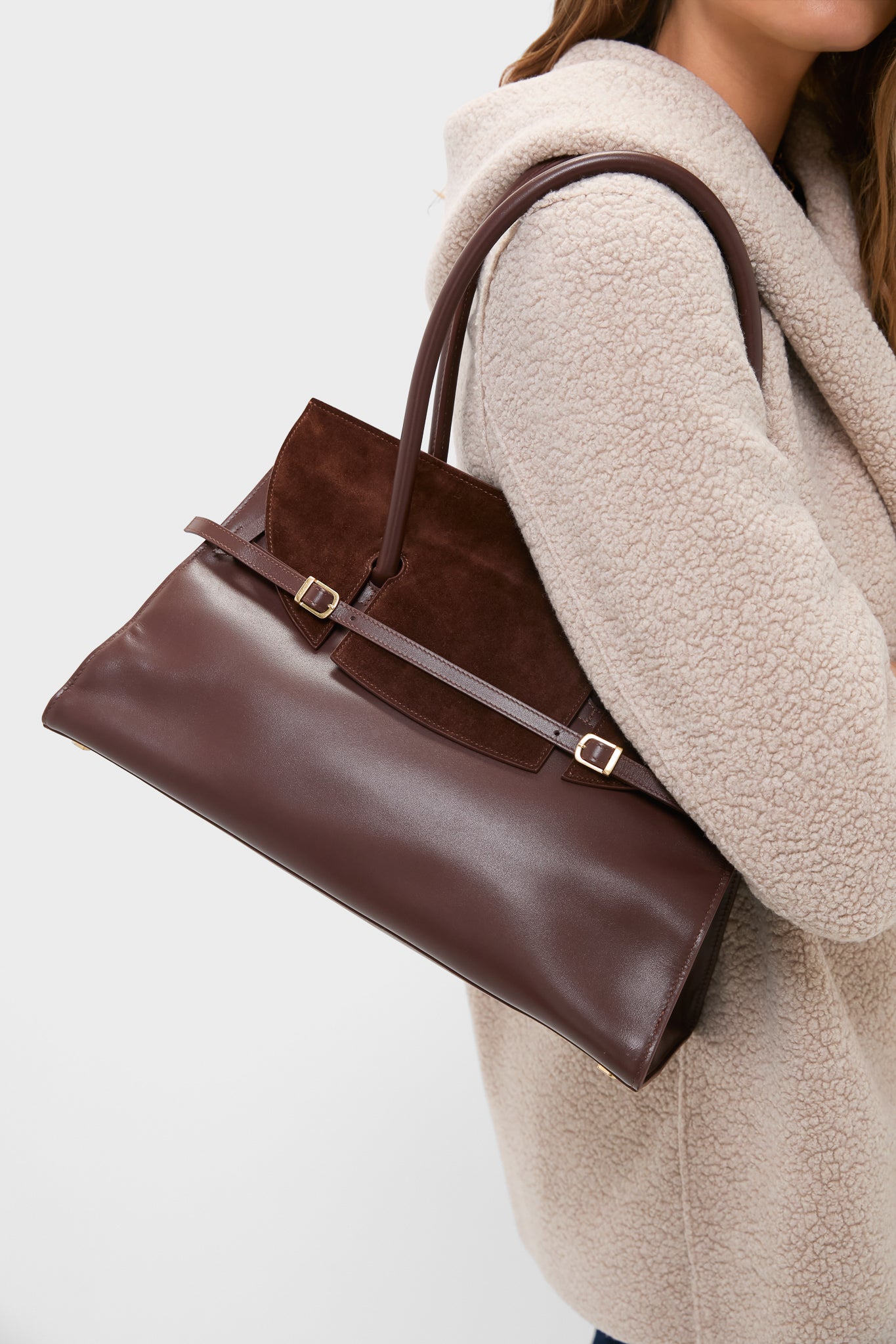 Model showcasing the Hickory River Suede Shoulder Bag—a classic, high-end accessory with a suede flap and slim belt detail, offering effortless, versatile style for any occasion.