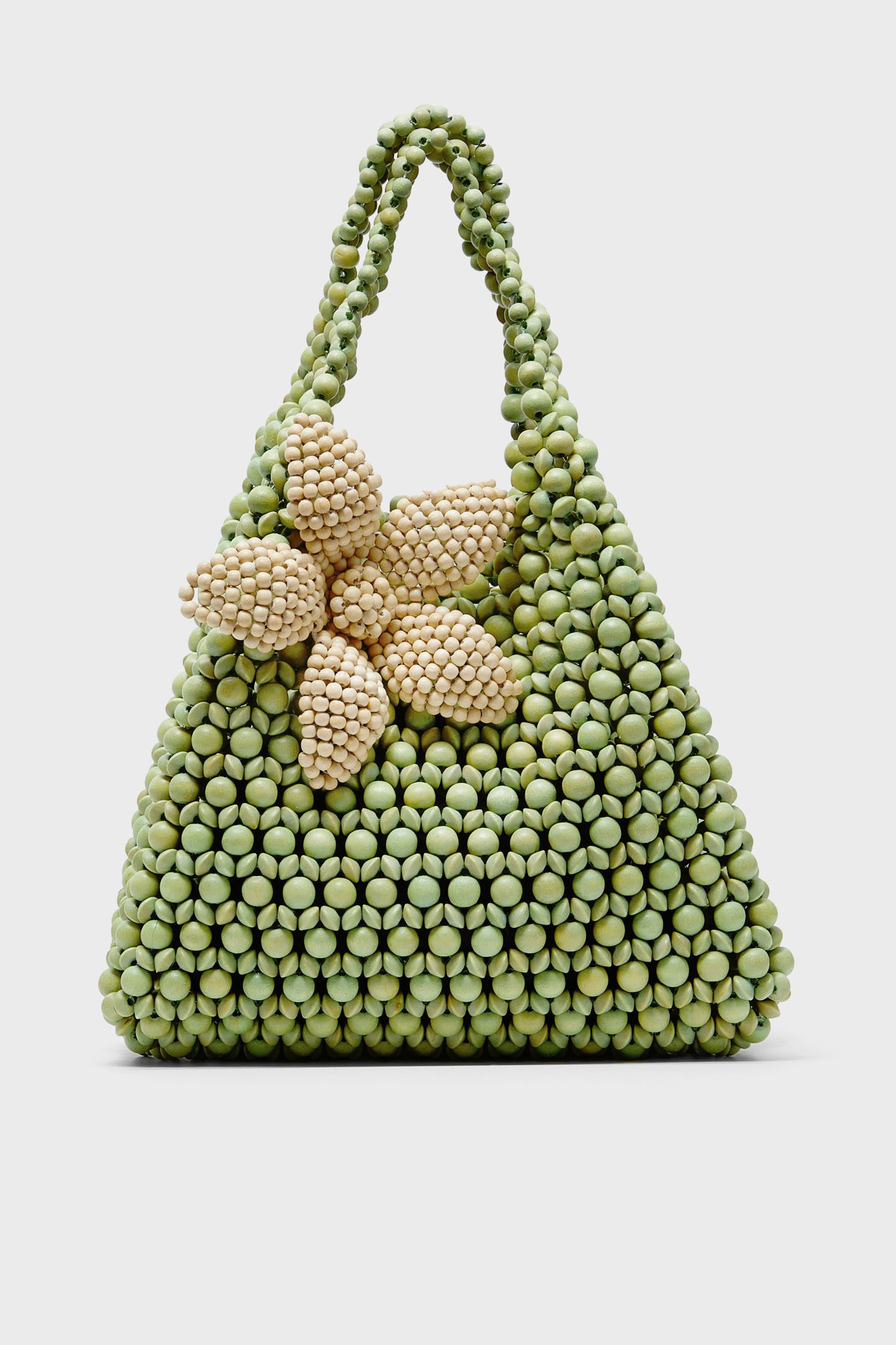 The Aranaz green wooden bead bag features a triangular shape, double handles, and a handmade beaded flower accent on the front.