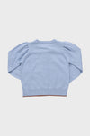 Light Blue Apple Constance Sweater, a classic long-sleeve pullover with puff shoulder detail, ribbed neckline and hem, embodying effortless, high-end style for fun, confident days.