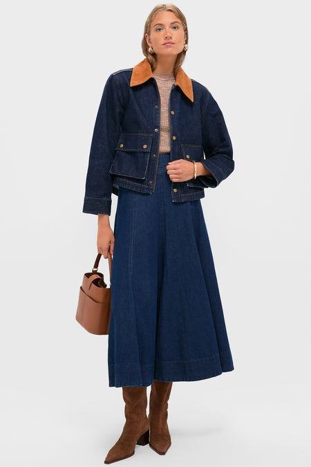 Woman wearing Midnight Rinse Denim Swingy Jacket with tan corduroy collar, styled effortlessly with a matching A-line skirt and suede boots, exuding a classic, high-end appeal.