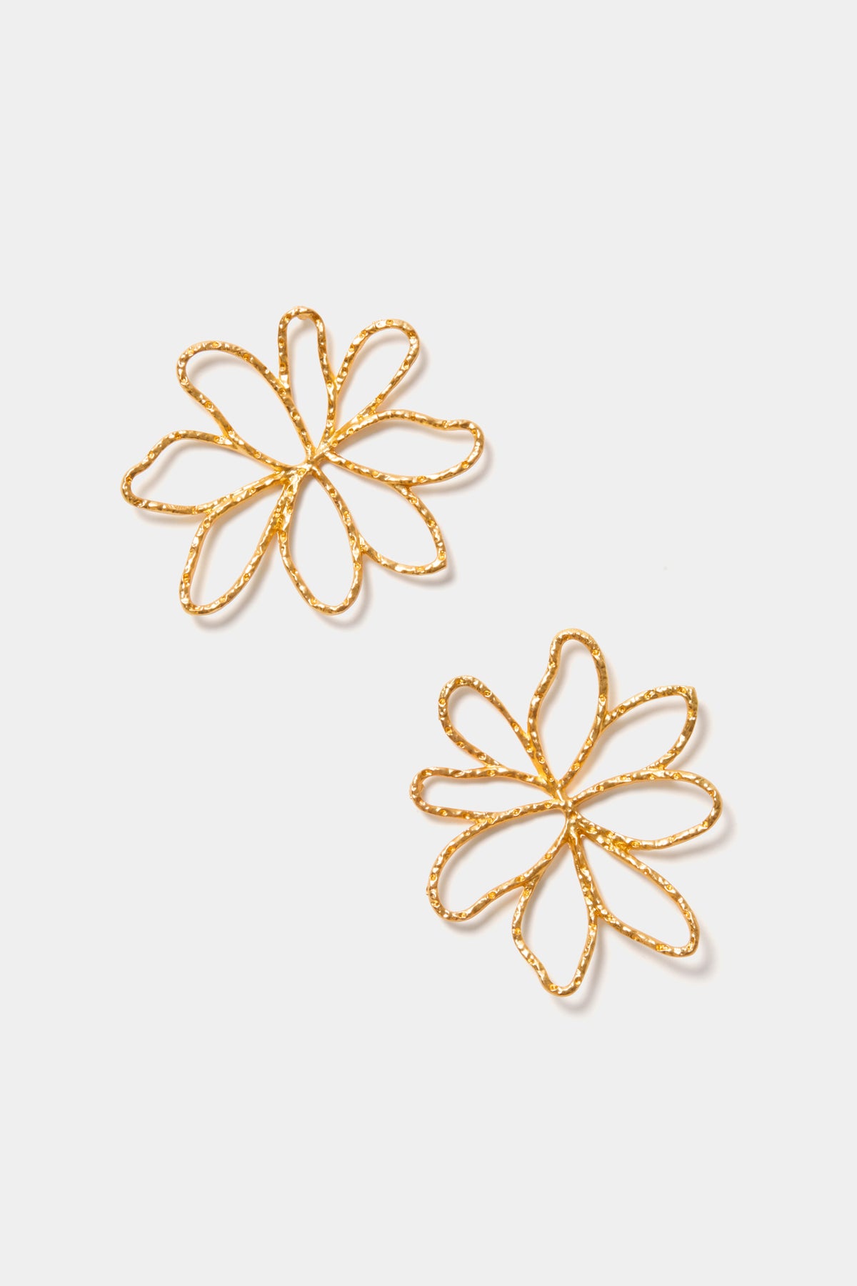 A pair of oversized flower earrings with a radiant gold-plated finish, inspired by the Gold Pomarinho Earrings by Petit Moments.