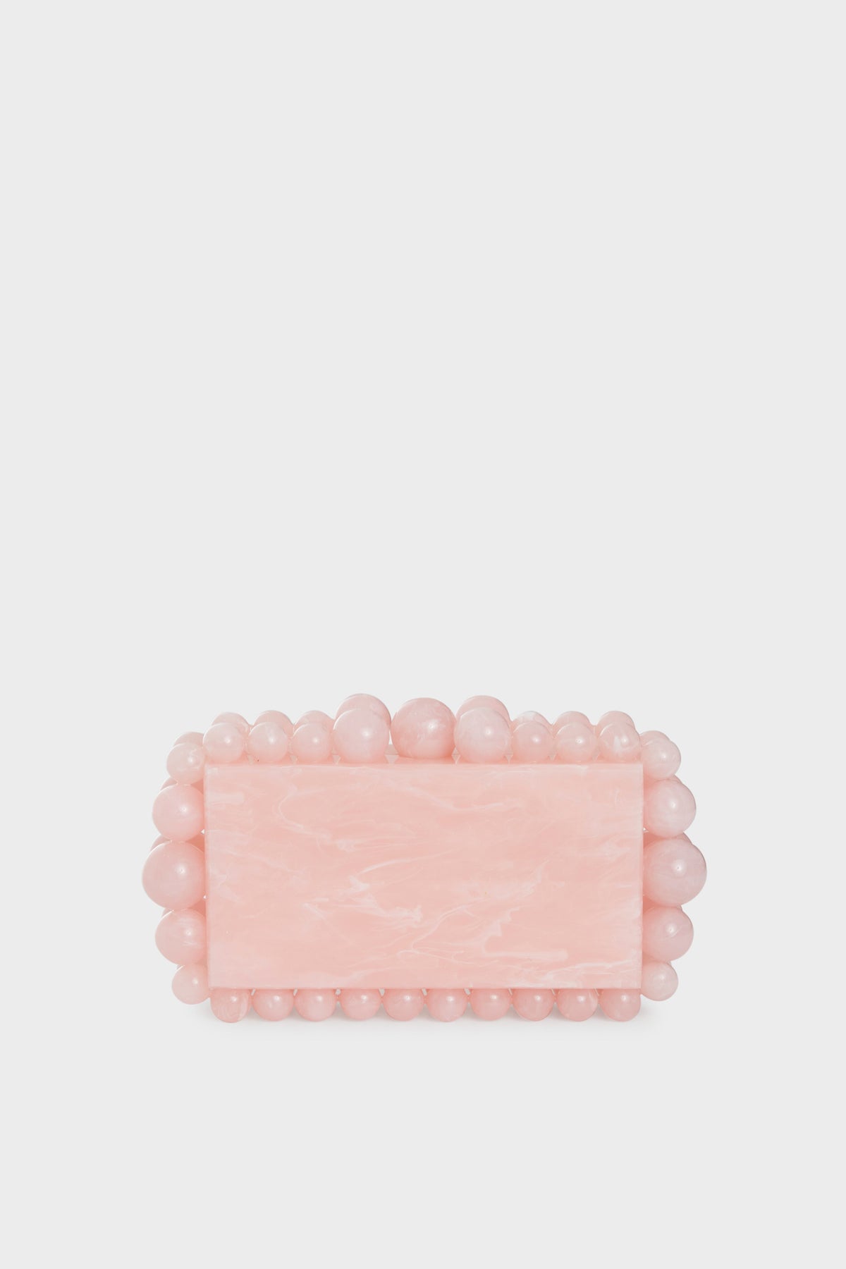 The Cult Gaia rectangular pink acrylic clutch features a marble-like finish with rounded pink beads outlining its edges, making it a chic beaded box clutch for stylish occasions.