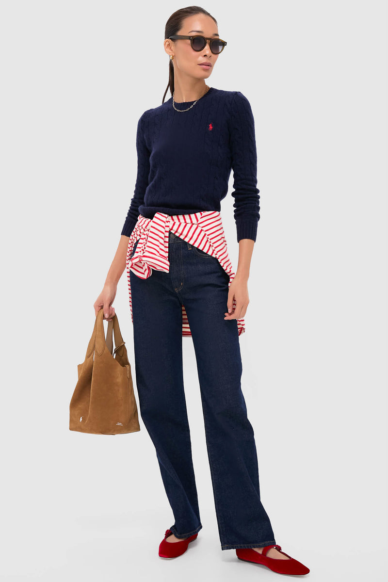 Woman modeling Red Velvet Ginger Mary Jane Flats with classic, effortless style; features velvet exterior, grosgrain piping, and adjustable arch strap, embodying high-end, fun fashion.