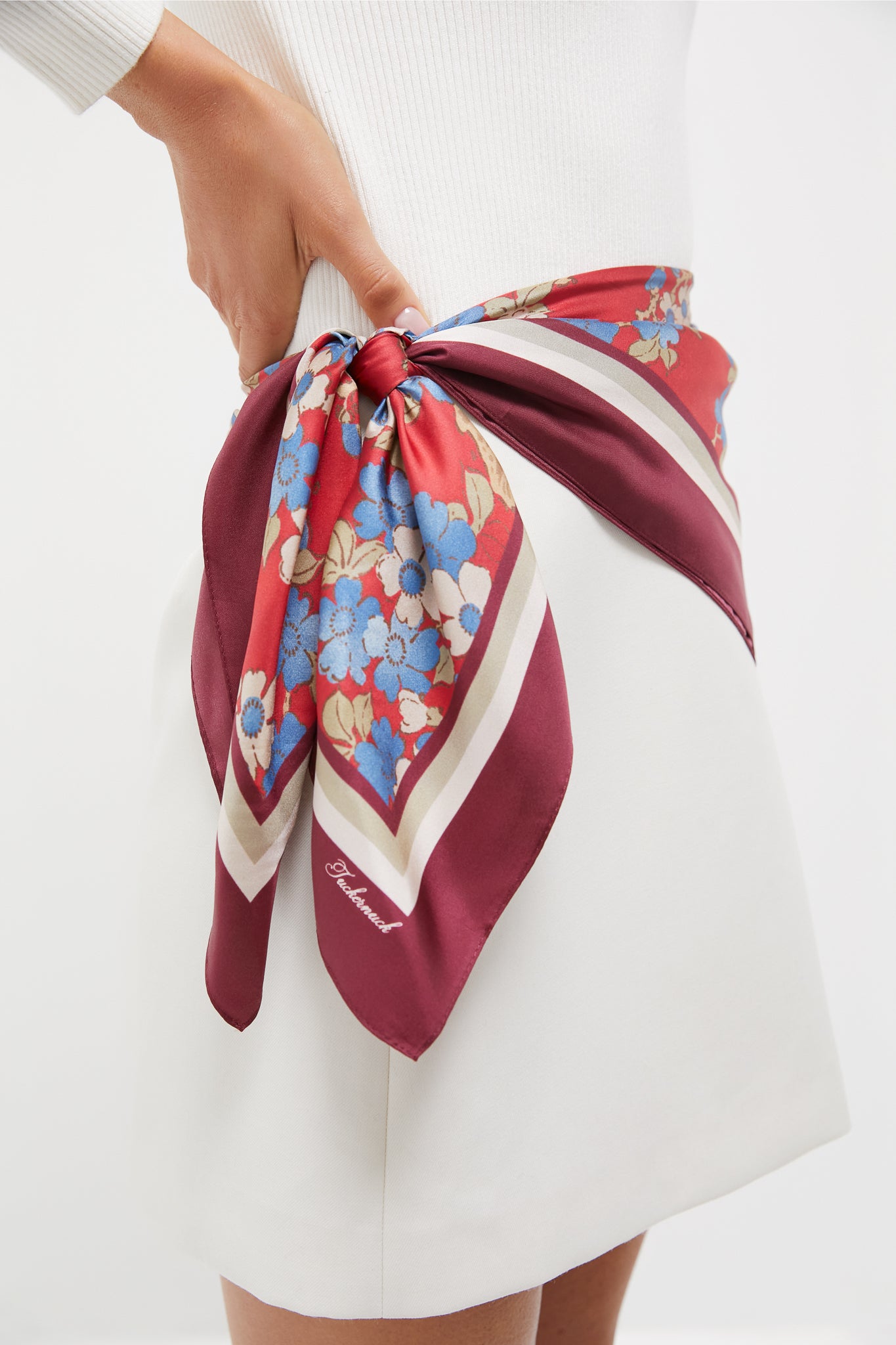 Scarlet Sakura Medium Silk Scarf tied as a belt around waist, showcasing classic, effortless style with high-end floral and stripe design in a fun, chic fashion.