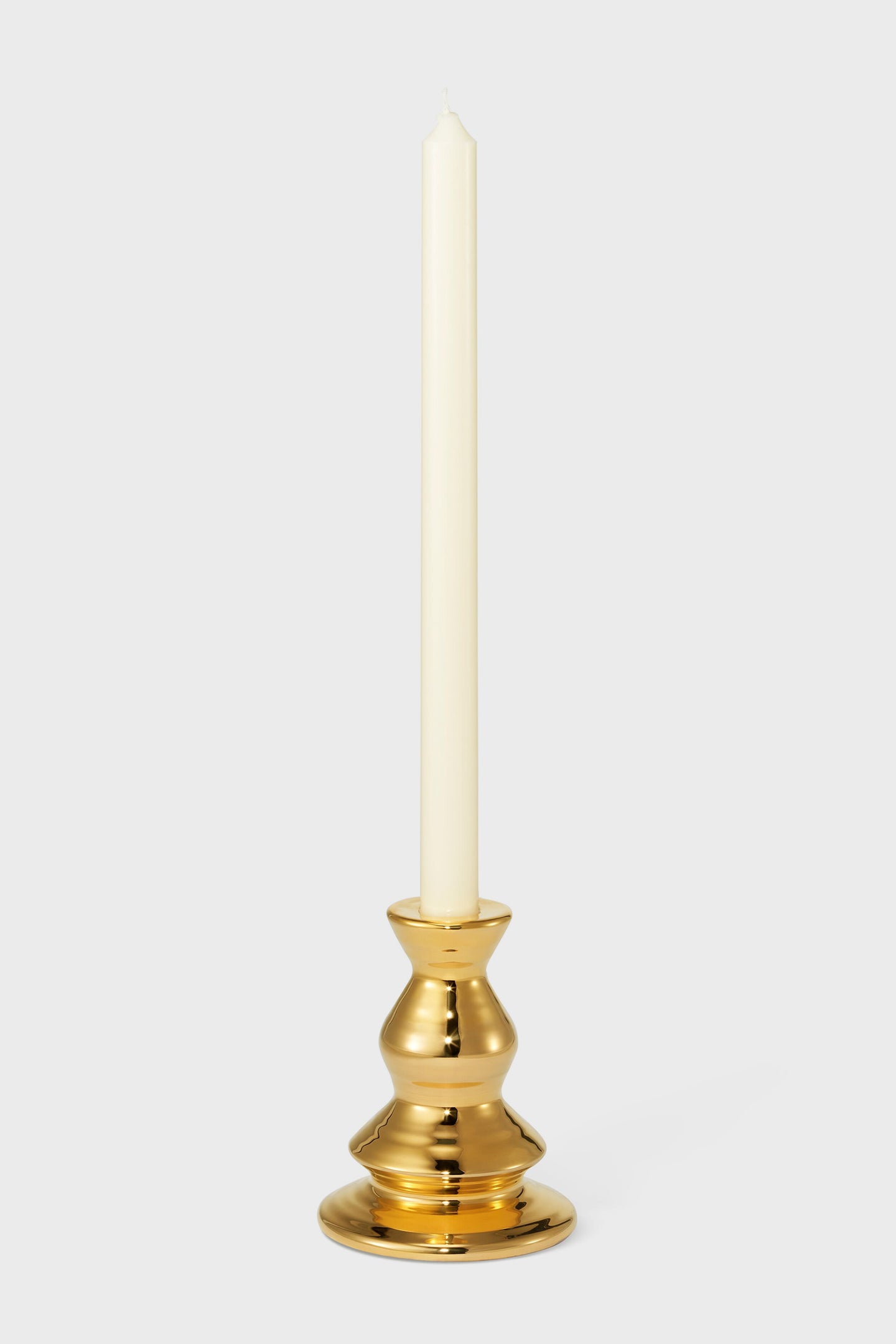 Medium Gold Allette Candleholder in a classic gold-metal design, effortlessly blending high-end style and fun sophistication, perfect for adding rustic character to any table setting.