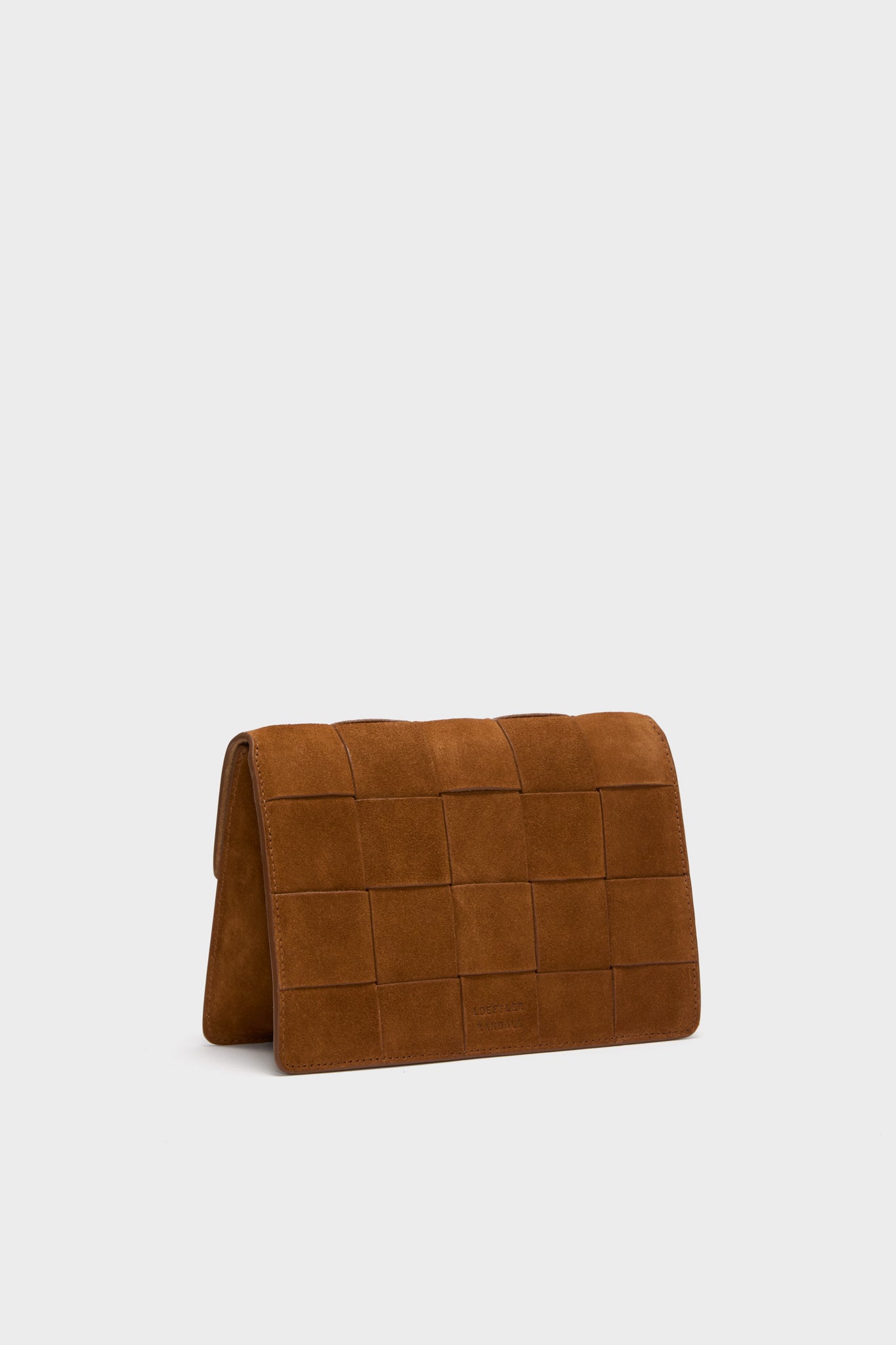 Woven Cacao Suede Delphine Crossbody Bag with classic flap design and embossed branding, featuring an effortless woven grid and fun crossbody strap for high-end versatility.
