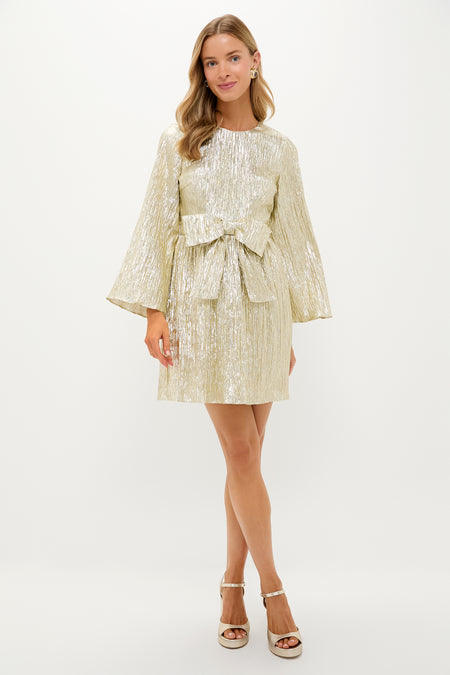 Gold Plisse Carol Bow Mini Dress with long bell sleeves and A-line silhouette, exudes classic, effortless style, perfect for fun, high-end occasions.