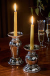 Graham 7 Pillar/Taper Candle Holder, handcrafted in hammered-silver with gold tapers, exudes a classic, effortless elegance, perfect for high-end entertaining and fun gatherings.