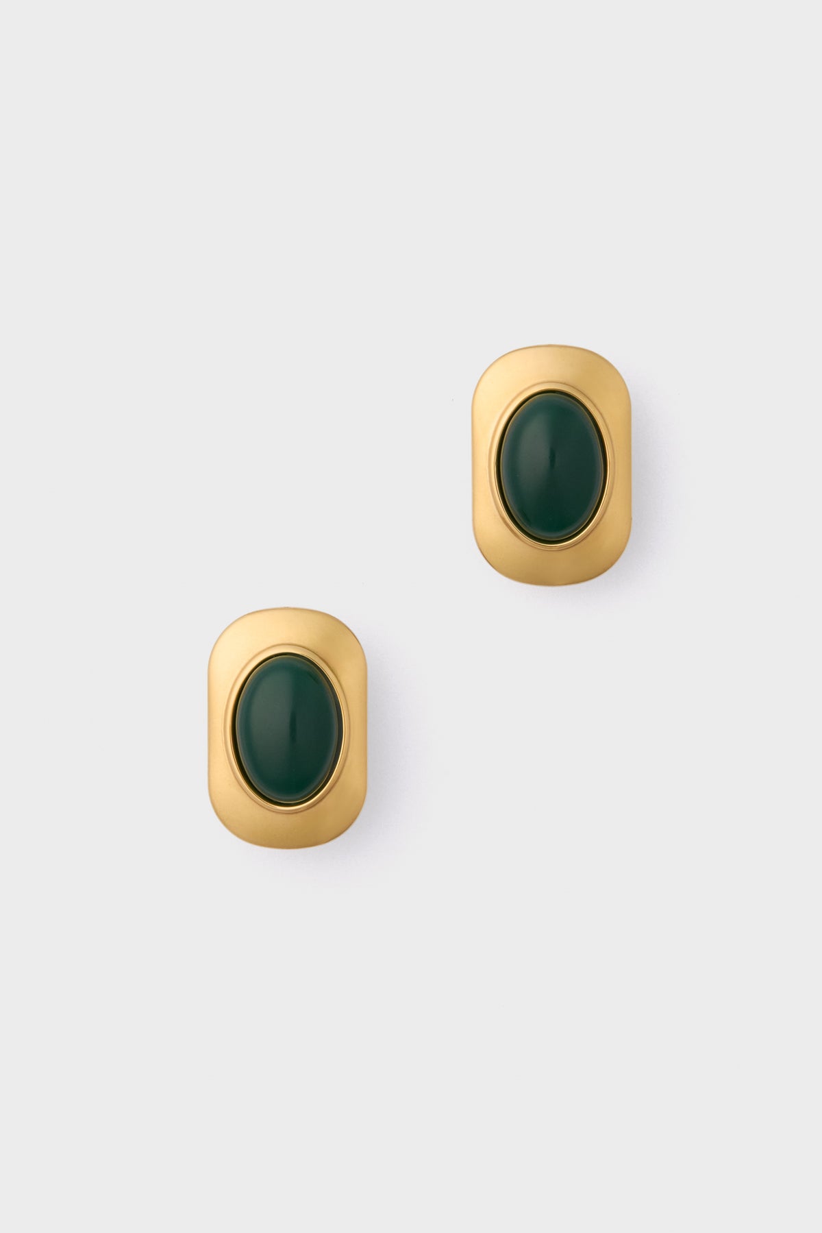 Petit Moments presents vintage-inspired gold-tone oversized studs with rounded edges, each adorned with a central dark green oval stone.