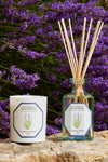 Lavender Candle by Carrière Frères on a stone slab with diffuser, embodying classic, effortless elegance and high-end aroma, perfect for a fun, sophisticated home ambiance.