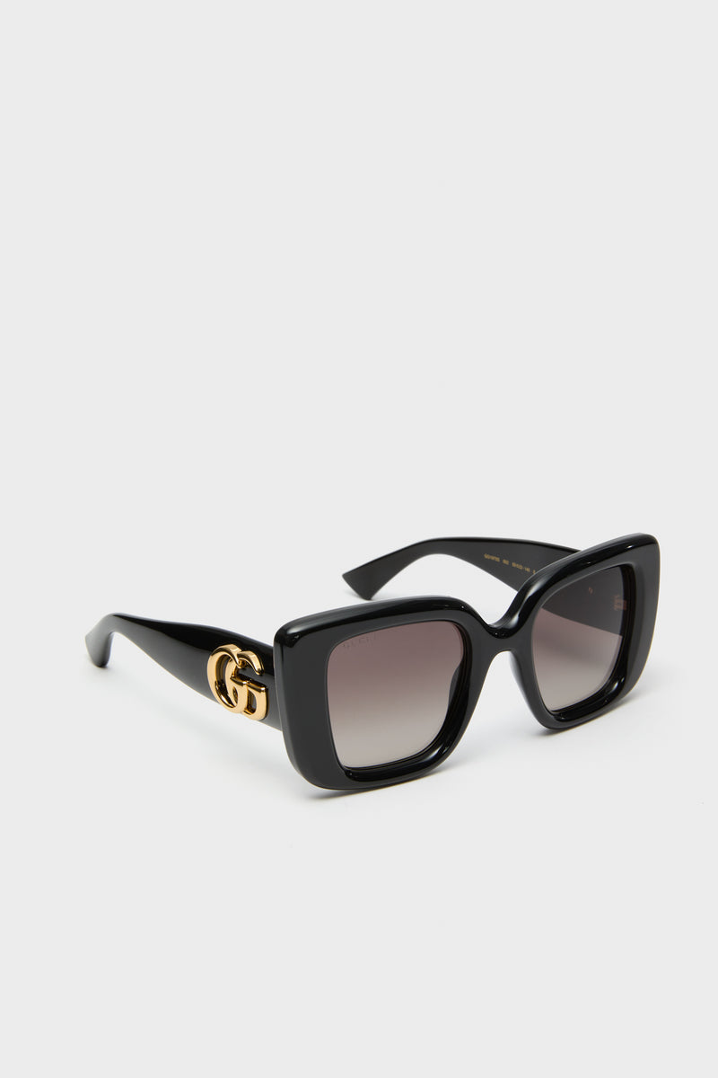 Shiny Black Square GG Bag Sunglasses in glossy acetate feature gradient lenses and Gucci's iconic gold-tone logo for a classic, effortless, and high-end style.