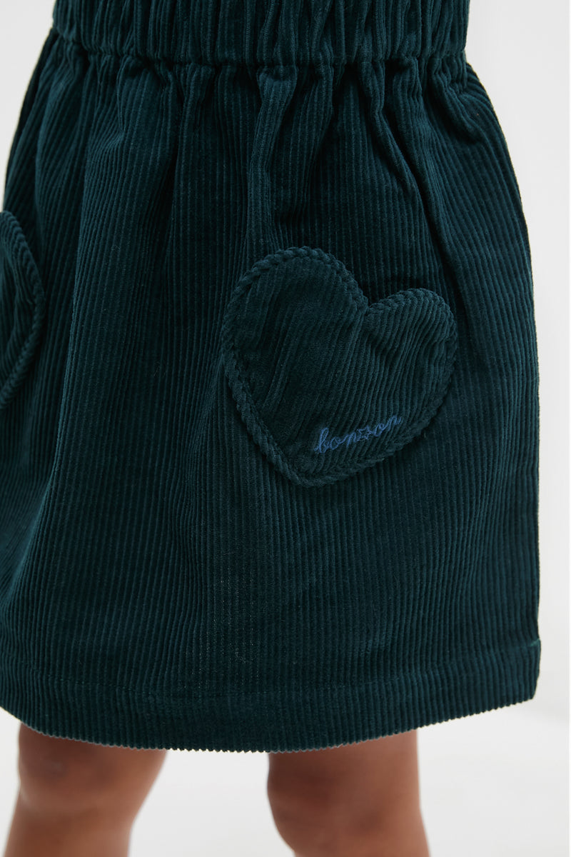Navy Douchka Skirt: Classic and effortless, this high-end corduroy skirt features fun heart-shaped pockets and a comfortable elastic waistband, perfect for your little fashionista.