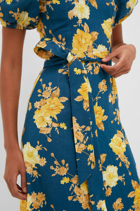 Nora Floral Navy Leiria Midi Dress: Effortlessly classic with puff sleeves and a self-tie belt, offering a fun yet high-end flair for any occasion.
