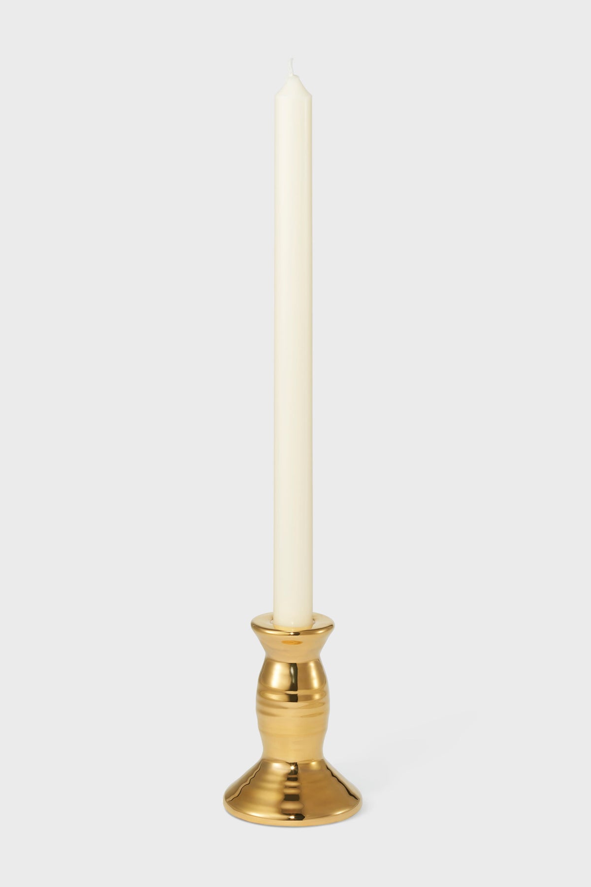 Small Gold Allette Candleholder: A classic, handcrafted porcelain holder with a 10k gold finish, showcasing effortless elegance and high-end craftsmanship. Perfect for fun, versatile table settings.