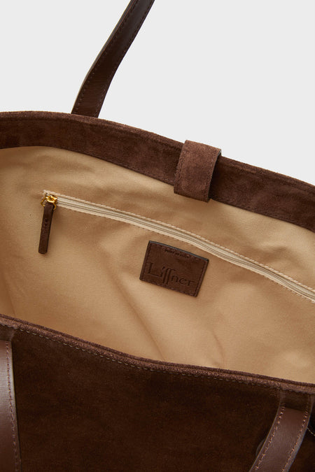 Close-up of the Dark Brown Suede Large Sprout Tote, showcasing its classic beige lining, zippered pocket, and effortless dark brown leather straps for a high-end, fun look.