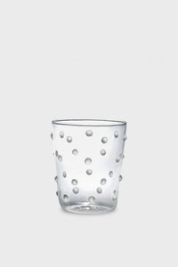 A clear Zafferano borosilicate tumbler featuring raised, round dots on the exterior, crafted in the brand’s signature style.