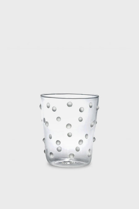 A clear Zafferano borosilicate tumbler featuring raised, round dots on the exterior, crafted in the brand’s signature style.