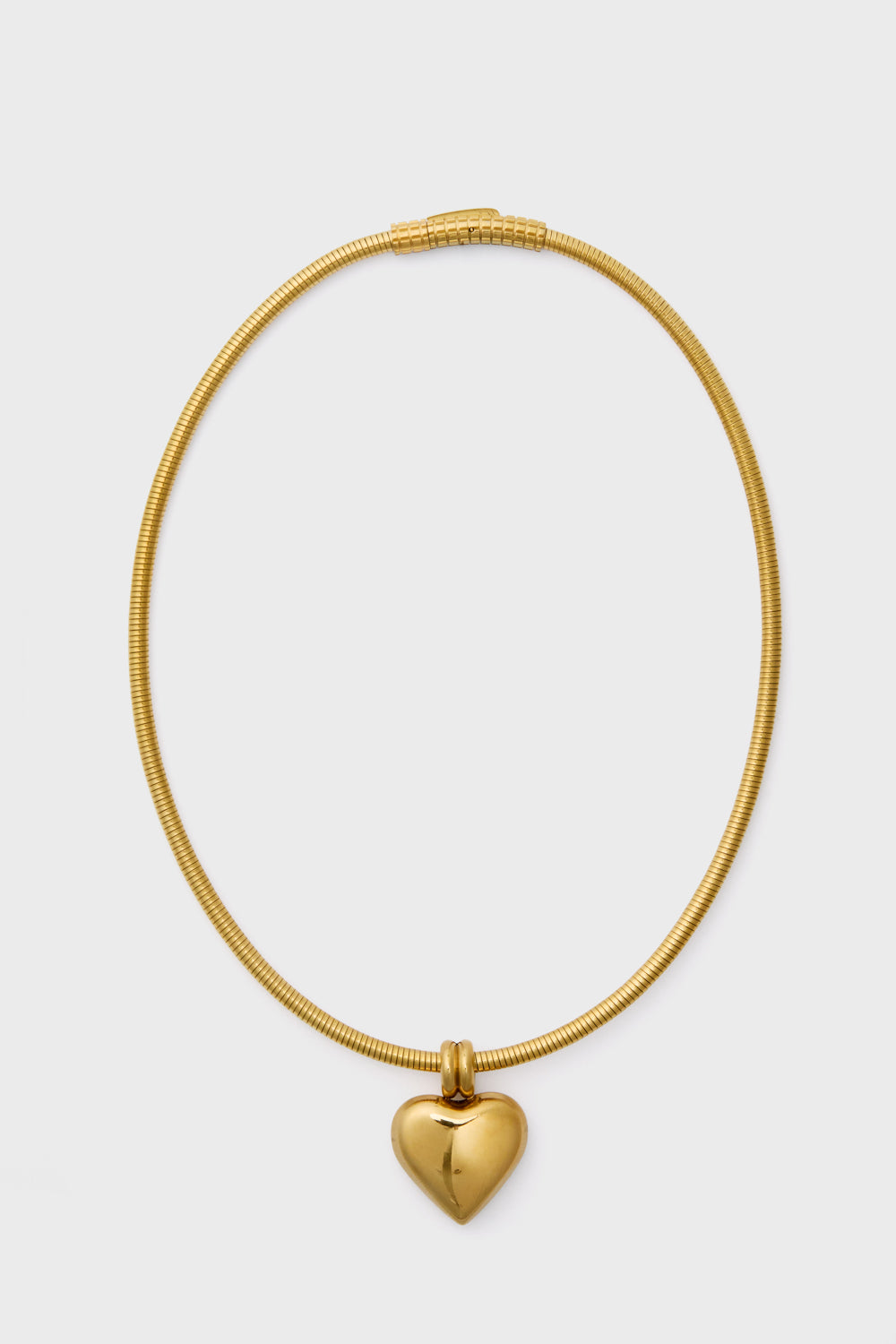 The Petit Moments Gold Irresistible Necklace features a delicate heart pendant on a gold-plated chain, making it the perfect accessory for any occasion.