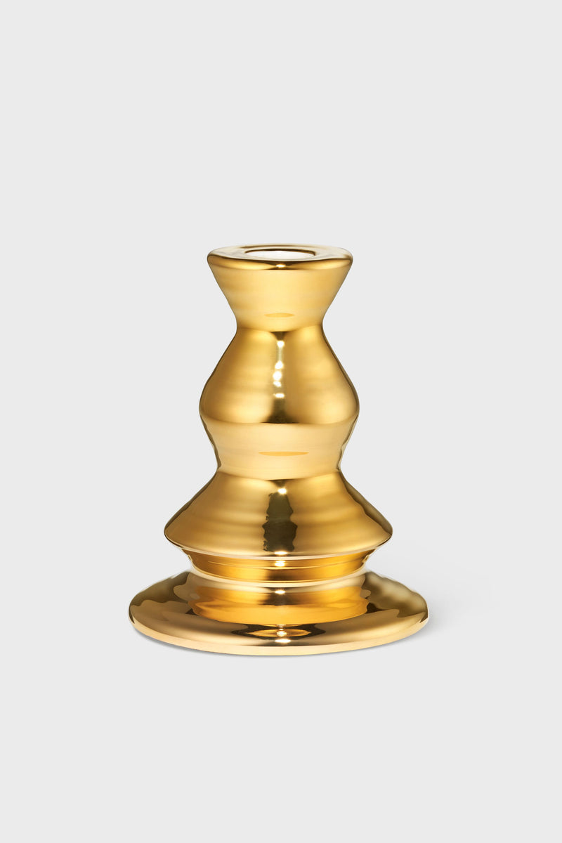 AERIN’s gold-colored, handcrafted ceramic candleholder features a reflective, curvy design, bringing artisanal elegance and upscale style to your home decor collection.