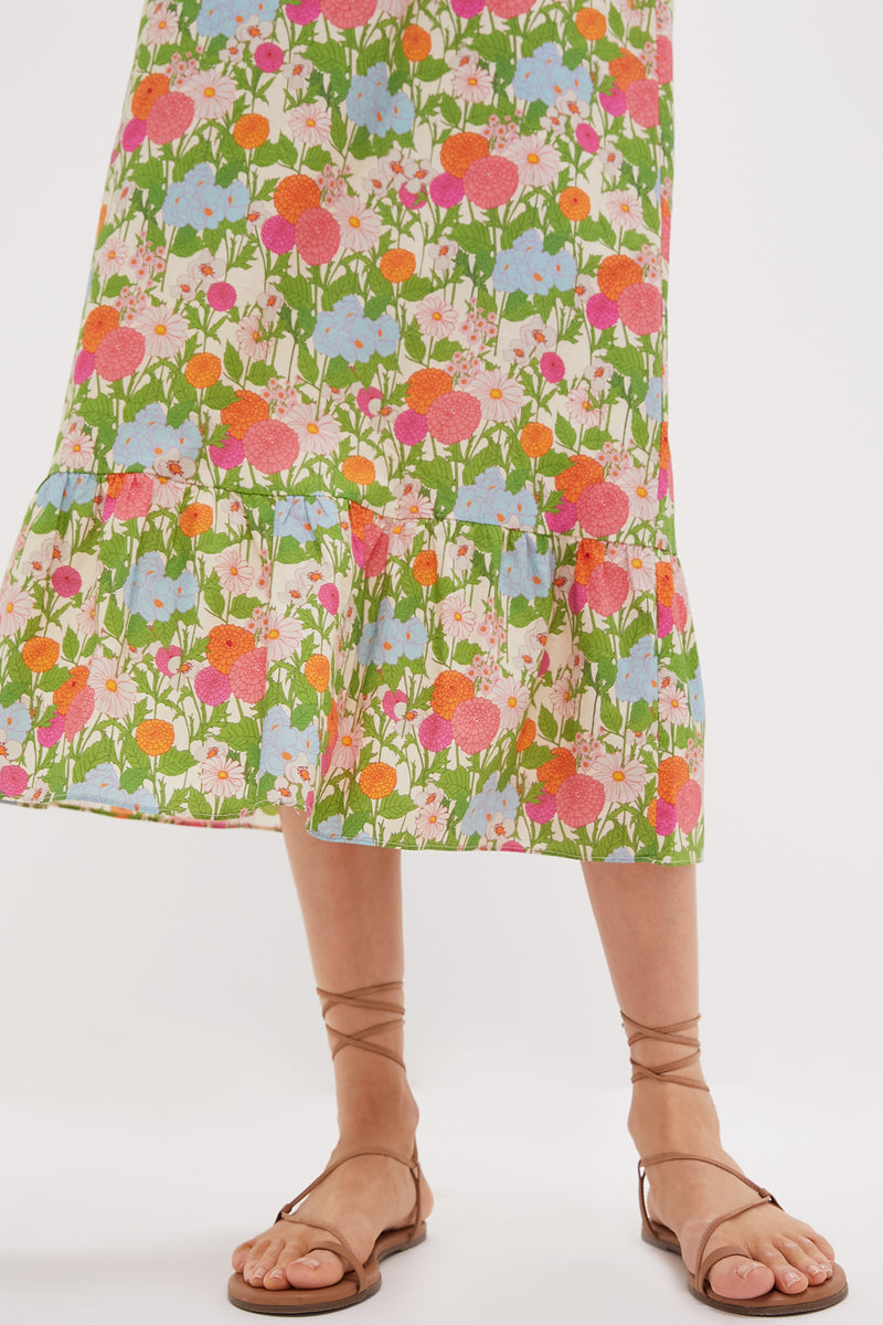 A person models the Multi Green Begonia Floral Mimi Midi Dress.