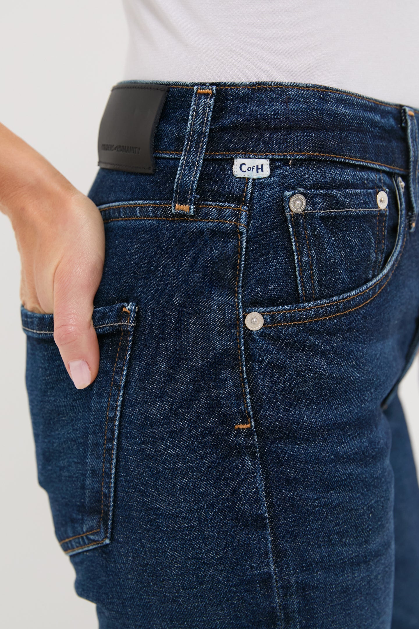 Sutherland Blaine Jean in dark blue denim, featuring classic straight-leg style and high-rise fit, effortlessly combines high-end craftsmanship with fun, vintage-inspired details.