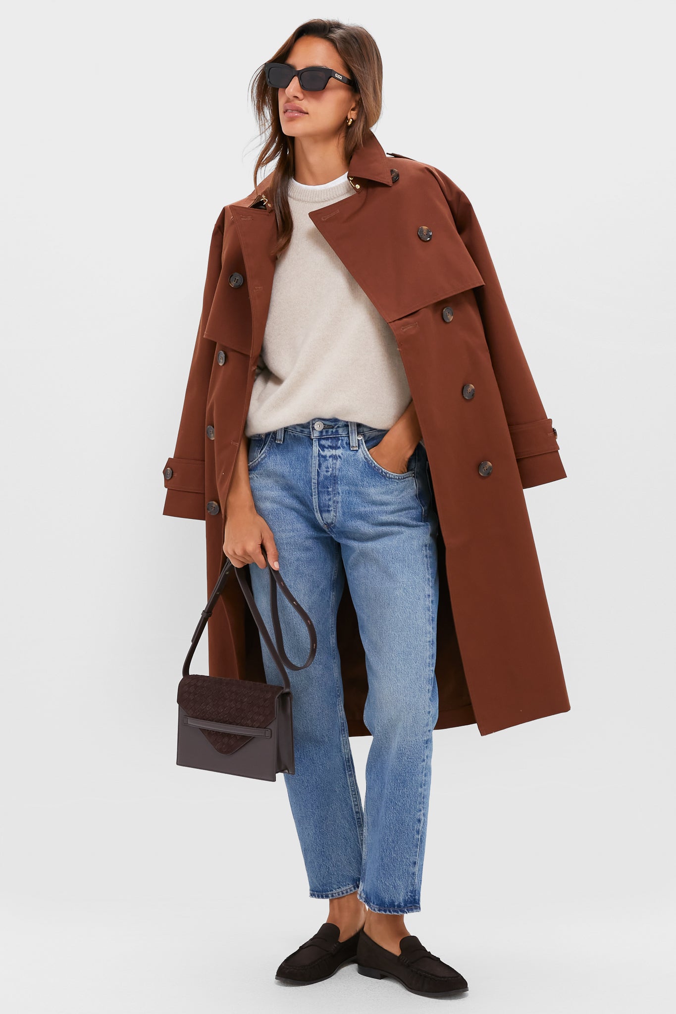 A woman models Chocolate Suede Vivian Loafers, exuding classic, effortless style. The high-end loafers complement her polished outfit, blending fun and sophistication seamlessly.