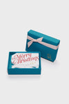 Merry Gift Tags in an open teal box, showcasing elegant white tags with festive red script and a ribbon, offering a classic, fun, and high-end gifting touch.