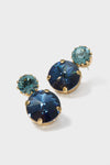 Lagoon Myrla Earrings: Classic stud earrings featuring navy and teal faceted crystals in gold-tone prongs for an effortless, high-end sparkle; perfect for fun, elegant occasions.