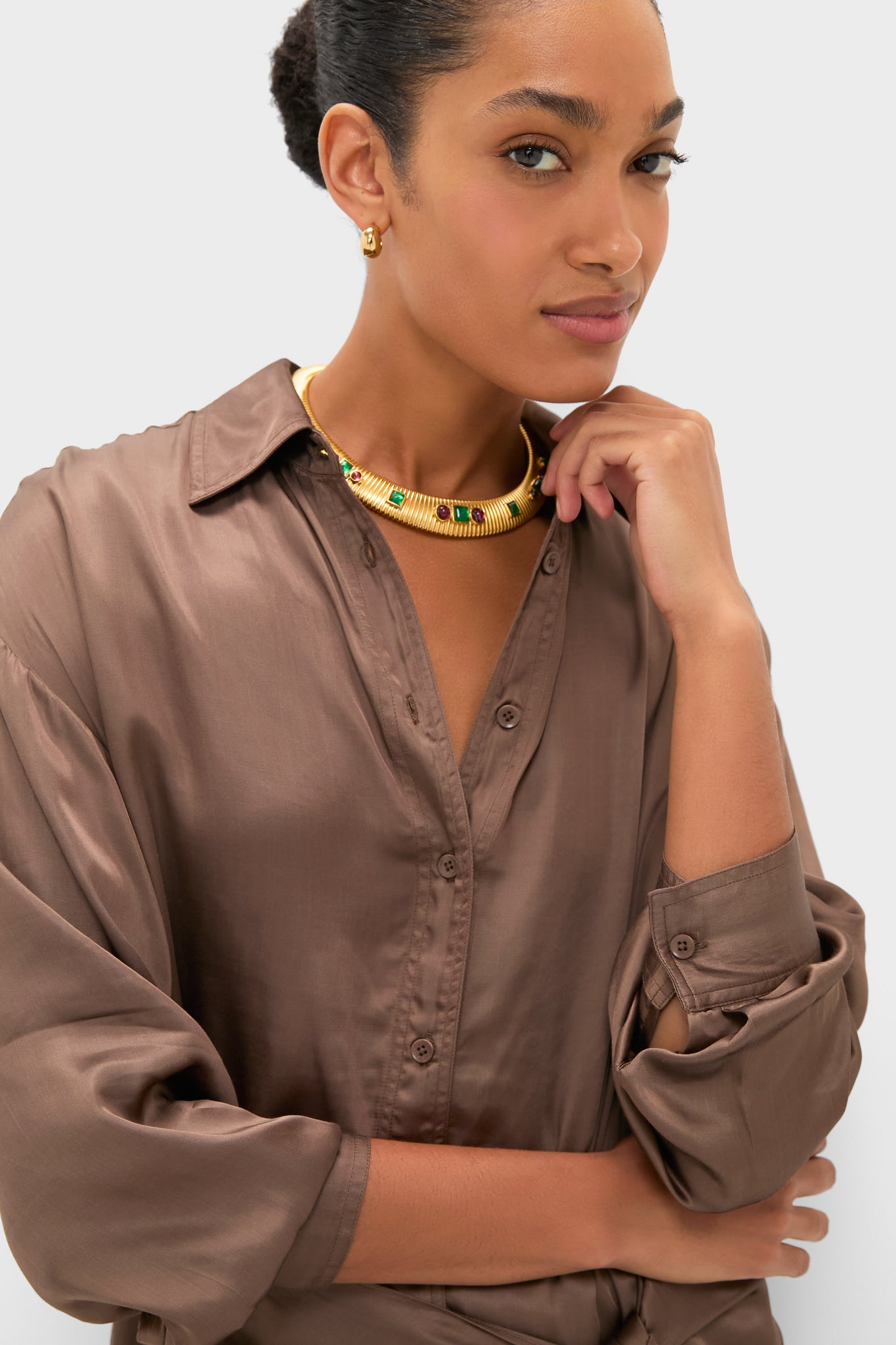 Woman in a silky blouse adorned with a gold necklace, showcasing the effortless and classic Morel Alessandra Sarong Shirt Dress, perfect for versatile, high-end styling.