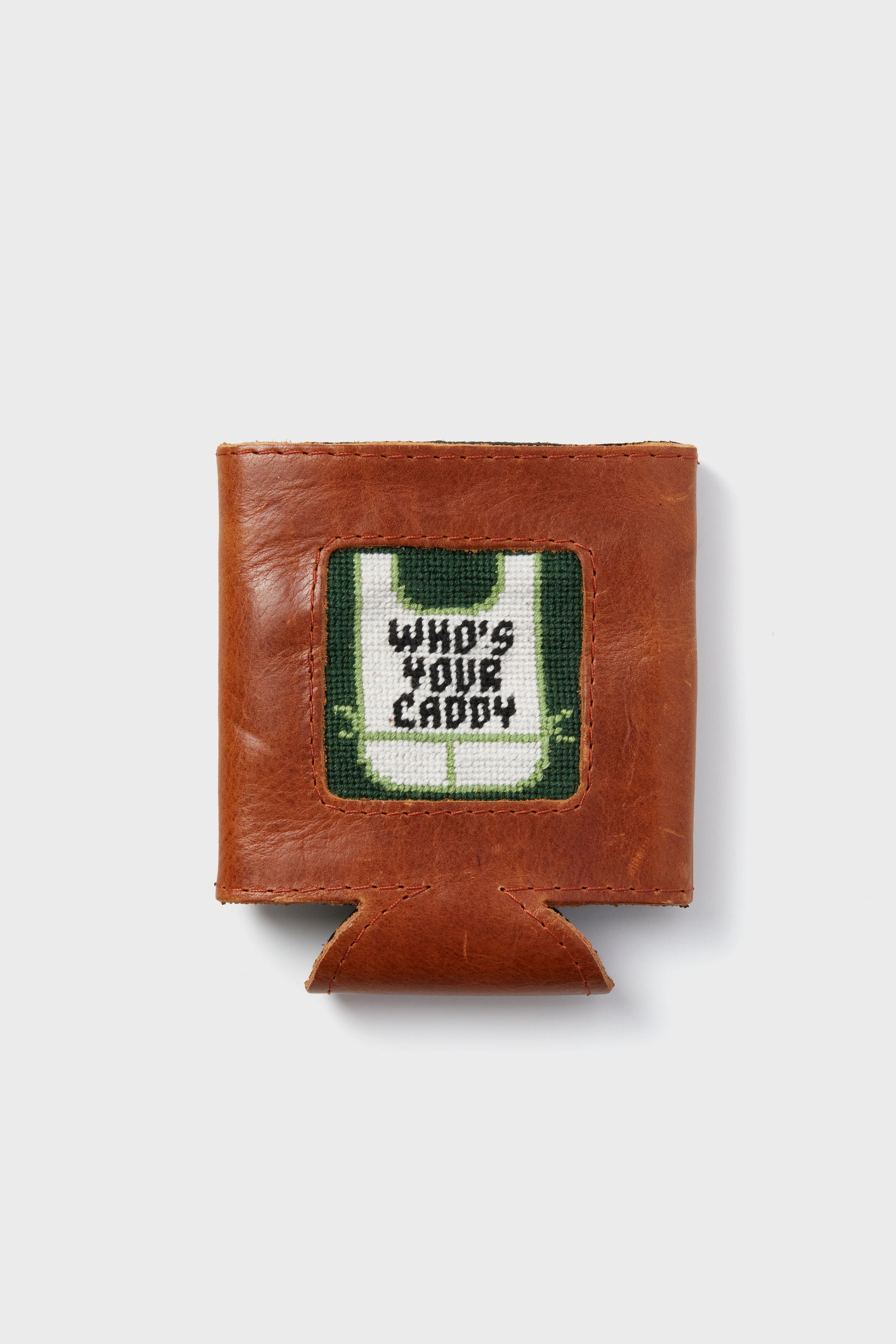 A brown leather wallet by Smathers and Branson features a stitched patch reading WHOS YOUR CADDY, making it an ideal golf gift.