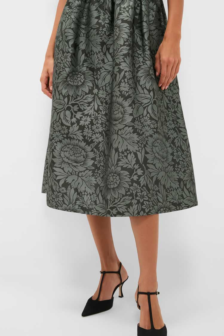 Emerald Mirasol Jacquard Adelaide Dress features a classic, effortless midi A-line skirt with floral jacquard and soft pleats, styled with chic T-strap heels.