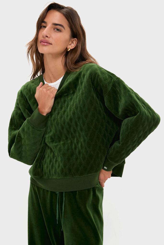 Model wearing Douglas Fir Velour Bennett Pullover; a classic, quilted, relaxed-fit sweatshirt in luxurious velour, paired with matching joggers for an effortless, high-end loungewear look.