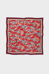 Scarlet Sakura Medium Silk Scarf, a classic accessory with stylized blossoms, offers effortless elegance and high-end versatility for a fun, chic look.