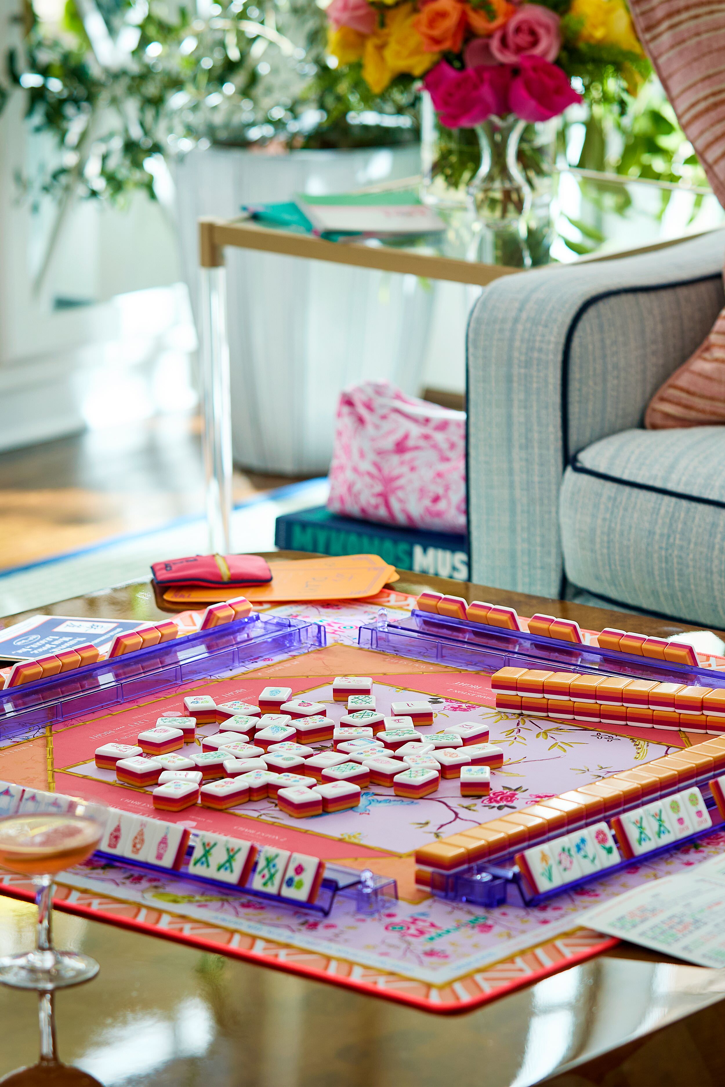 Goldie Playing Mat, with its vibrant floral design, enhances this classic, high-end mahjong setup, making the game effortlessly fun with its non-slip surface and instructional edges.
