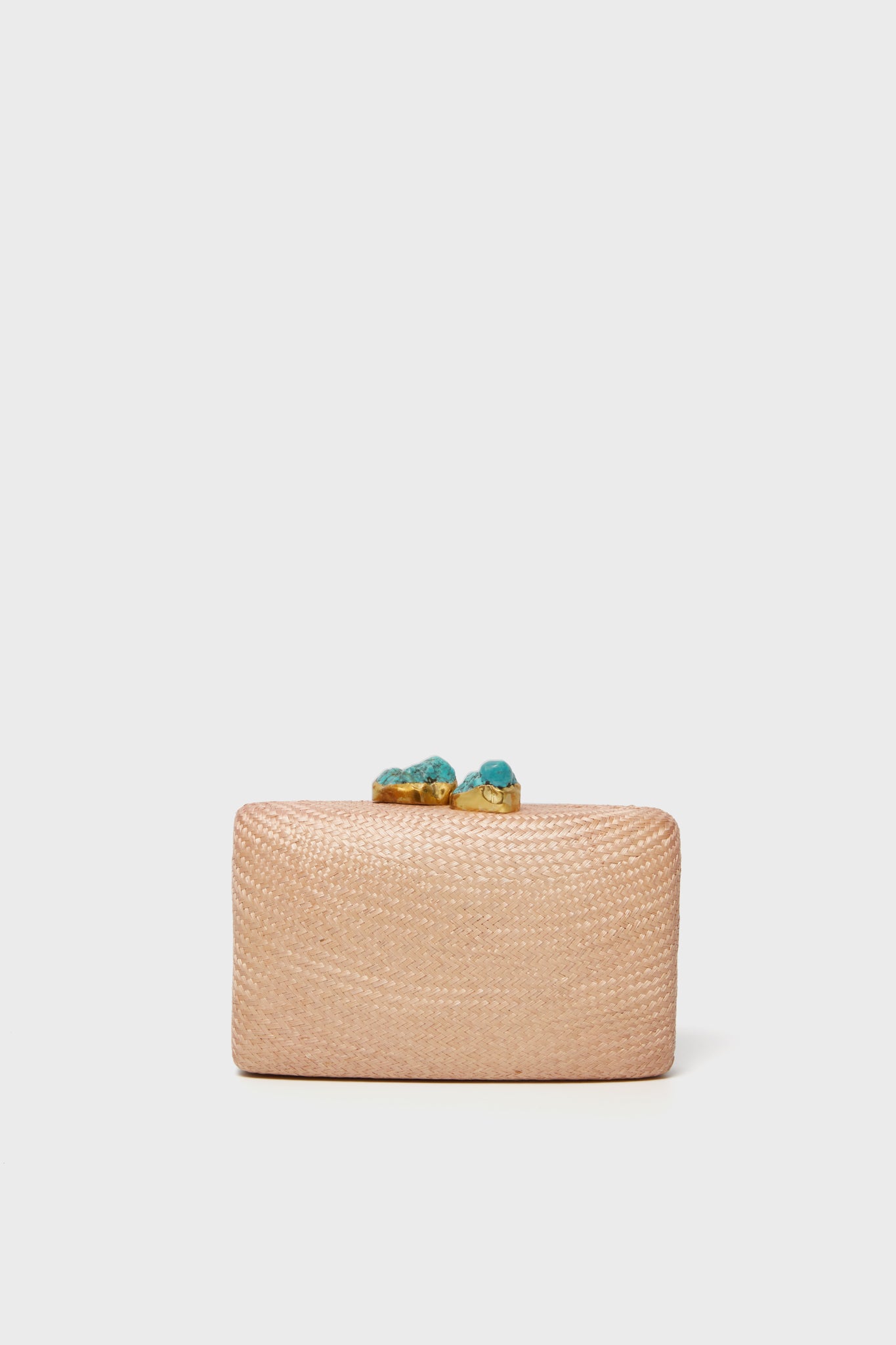 Kayu’s rectangular woven beige straw clutch features a decorative clasp with two turquoise stones. Handcrafted for sustainability, this evening bag is a stylish accessory for any occasion.