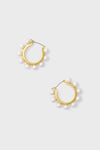Tuckernuck Jewelry gold hoop earrings, each accented with evenly spaced white pearls, offer a refined and elegant accessory.