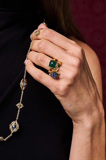 Hand holding a classic Blue Labradorite Mystic Eye Gem Ring in hammered gold, showcasing its effortless elegance and high-end design, perfect for fun, versatile styling.