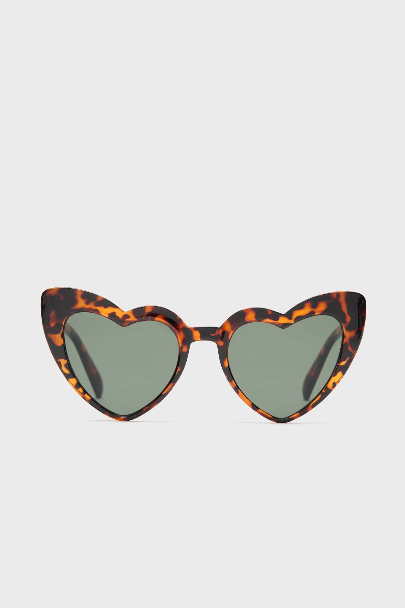 A.J. Morgan Eyewear heart sunglasses feature tortoiseshell frames, green-tinted impact-resistant lenses, and UV400 protection for stylish, safe wear.